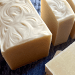 Freshly cut soap bars sitting on a bluecloth